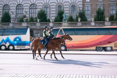 Mounted police patroling, the area round the Swedish royal castleのeditorial素材