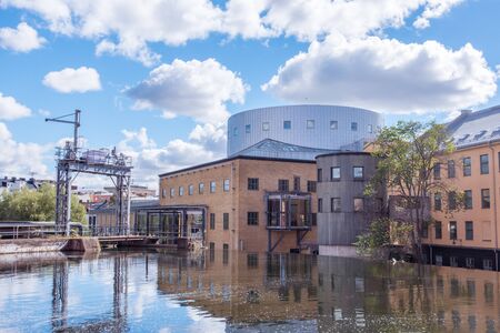 Norrkoping, Sweden - September 5, 2016: Motala river cuts through Norrkoping city, many of the buildings by the water is from Norrkopings textile industry era which ended in the 1950-tiesのeditorial素材