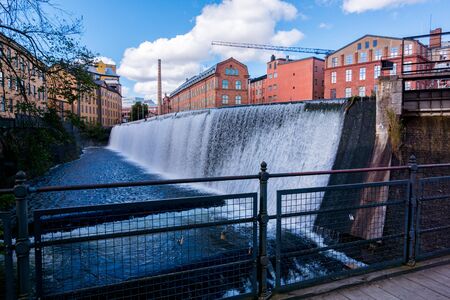 Norrkoping, Sweden - September 5, 2016: Motala river cuts through Norrkoping city, many of the buildings by the water is from Norrkopings textile industry era which ended in the 1950-tiesのeditorial素材