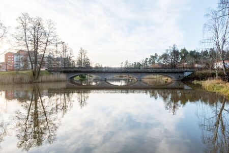 Mjolby, Sweden- November 30th, 2017: Mjolby town centerbridge over the river kalled svartanの写真素材