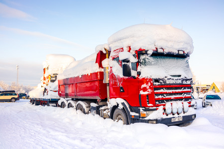 Kiruna, Sweden - February 3 2018: Parked red truck with heavy snow on topのeditorial素材
