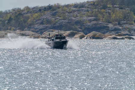 gothenburg, Sweden- April 24: CB90-class fast assault craft in the southern archipelago driving fast.のeditorial素材