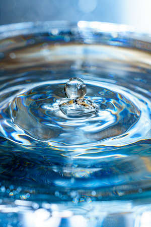 Drops hitting waterの写真素材
