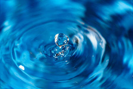 Drops hitting waterの写真素材