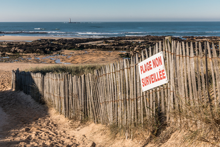 French sign Unguarded beach on wood fenceの写真素材
