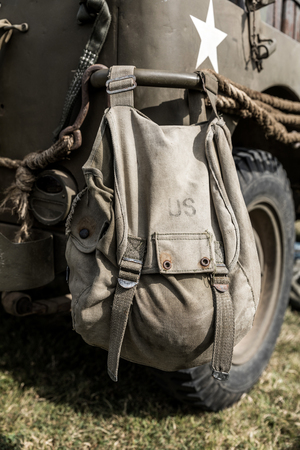 Old US military bag hanging on the back of a vehicleの写真素材