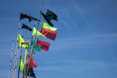 Fishing colorful buoys flags in the harborの写真素材