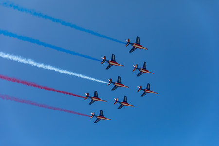 Patrouille de France (French Acrobatic Patrol) with blue white and red smokeの写真素材