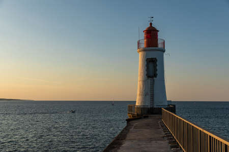 Lighthouse of the great jetty of Sables d'Olonne at dawn (Vendee, France)の写真素材