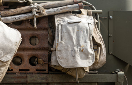 Green military combat helmet on an old vehicle for World War 2 historical reenactmentの写真素材
