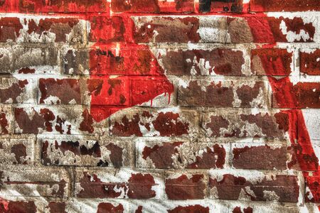 Wall of red bricks with rest of white color.の写真素材