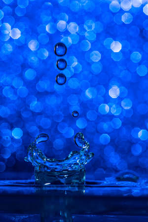 High speed with blue drops against a blue backgroundの写真素材