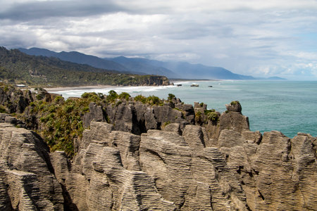 View of the Pancake Rocks near Punakaiki, New Zealand, with oceanの写真素材