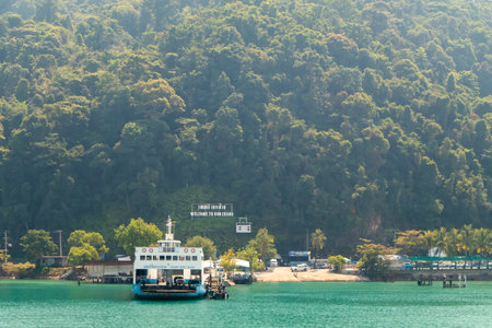 Thai ferry boat with cars on deck at sea to Koh Chiang Thailandの写真素材