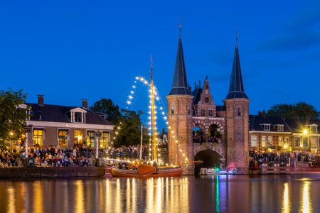 View of the old town of Amsterdam at night. Amsterdam is the capital and largest city of the Netherlands.の写真素材