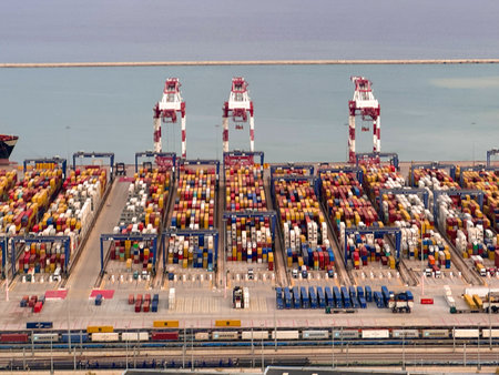 Container terminal for loading bulk cargo of iron ore by ship cranes and grabs.の写真素材