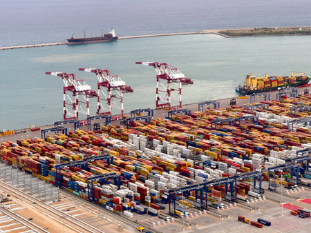 Container Cargo freight ship with working crane bridge for Logistic Import Export background