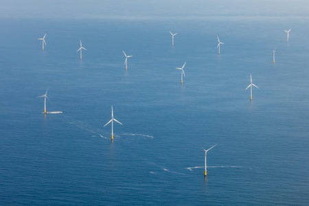 An image of windturbines in the mediterranean sea.