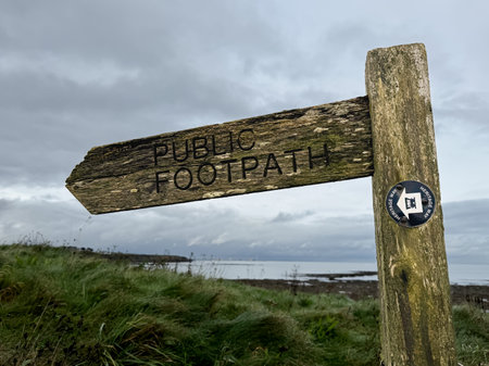 Wooden signpost on the North Sea coast in Wales