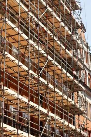 Scaffolding on a house, renovation workの写真素材
