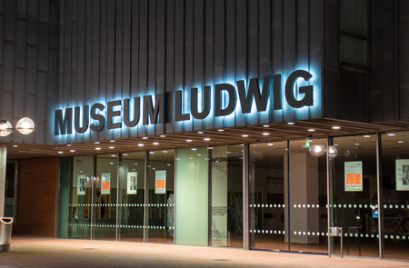 main entrance museum Ludwig in Cologne, illuminated sign, closed doorsのeditorial素材