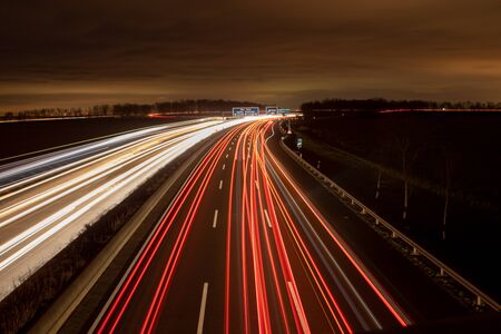 highway in the dark, headlight lightsの写真素材