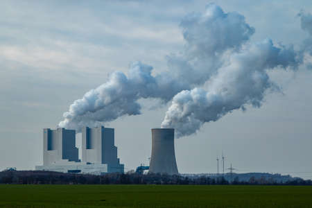 Rommerskirchen NRW, Germany, 07 03 2020, RWE coal fired power plangt Neurath, chimney with exhaust gases, cloudy skyのeditorial素材