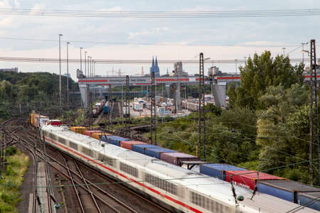 Huerth, NRW, Germany, 06 27 2020, cargo train before skyline of cologne, container station cologne...