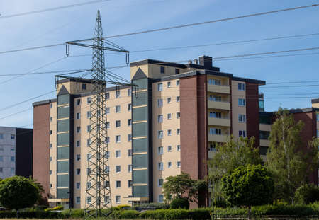 Huerth, NRW, Germany , 31 05 2020, high appartment building, powerlines in front of the building, cloudy skyのeditorial素材