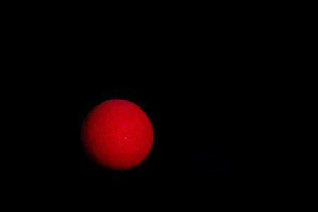 close-up of a red foam nose with black background, Carnivalの写真素材