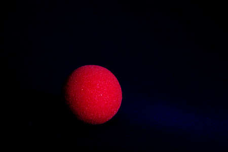 close-up of a red foam nose with black background, Carnivalの写真素材