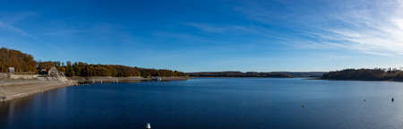 Panorama view of lake at Moehnetalsperre, water reservoir, in Sauerland region, Germany, blue skyの写真素材