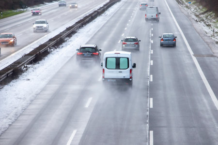Cologne, NRW, Germany, 01 24 2021, cars on the German highway A4, wet and snowy weather, daylightのeditorial素材