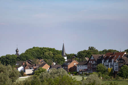 Huerth, NRW, Germany, 06 11 2021, village with church tower on a hillのeditorial素材