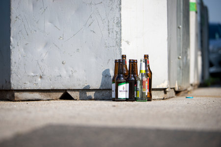 Huerth, NRW, Germany, 06 26 2021, glass bottles standing in front of a glass container, recyclingのeditorial素材