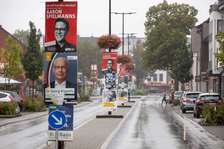 Huerth, NRW, Germany 08 29 2021, severel SPD, CDU and others election posters and billoards in a village street, fixed on street lamp mast.のeditorial素材