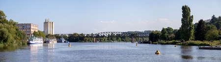 Hameln, Lower Saxony, Germany, 09 03 2021, view on Weser river and old metal bridge at Hamlen...