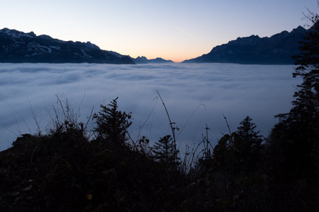 Shortly before entering the sea of fog in the valley: A scenery in the mountainsの写真素材