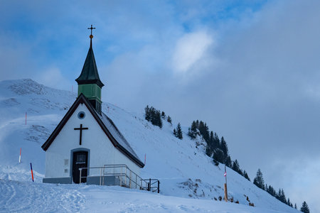 A beautiful chapel on the ridge of Kronberg, a mountain in Switzerlandの写真素材