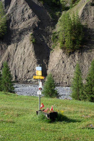 Hiking signs at the border to Swiss National Park close to Parkhuette Varuschの写真素材