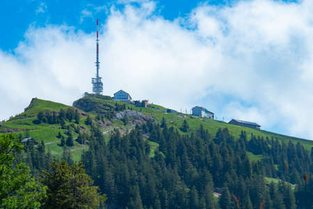 View towards Rigi, a mountain in Switzerland, partly partly surrounded by cloudsの写真素材