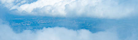 View from Rigi, a mountain in Switzerland, through a window of cloudsの写真素材