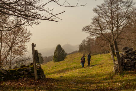 Two hikers on their way to Chasseral, a peak in the Swiss Jura mountains.の写真素材