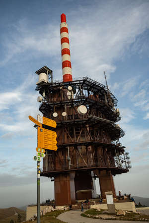 Chasseral, Switzerland - November 7th 2020: Tower and hiking signs on the topの写真素材