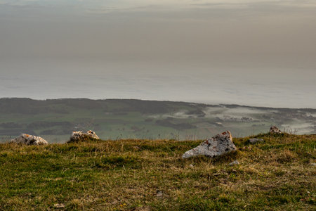 View from Swiss Jura chain over the sea of fog of Lake Biel on an autumn dayの写真素材