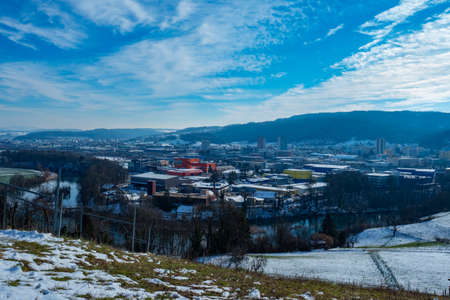 View over the green meadows of Limmattal. Switzerland, towards the urban valleyの写真素材