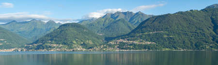 View from Colico towards the opposite side of lago di como with mountainsの写真素材