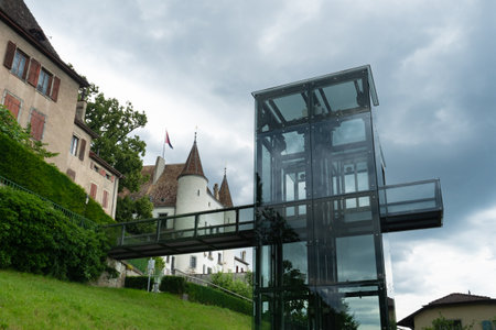Nyon, Switzerland - July 10th 2021: The modern elevator building gives access to the historic castleのeditorial素材