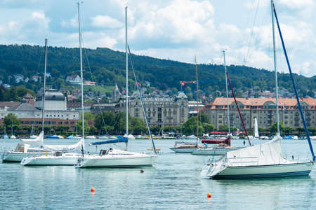 Zurich, Switzerland - July 13th 2019: Lying sailing boats in front of the city centre.のeditorial素材