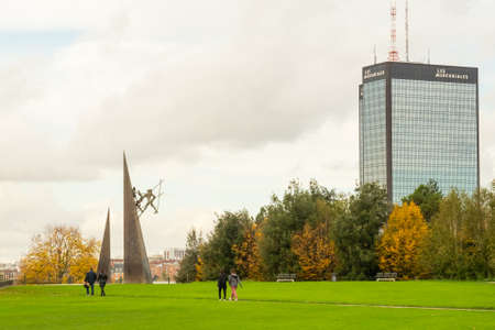 Paris, France - November 5th 2019: Beautiful park Jean-Moulin with the Mercuriales tower in Bagnolet